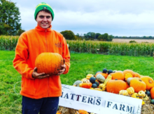 Hatter's Farm Ross holding pumpkin