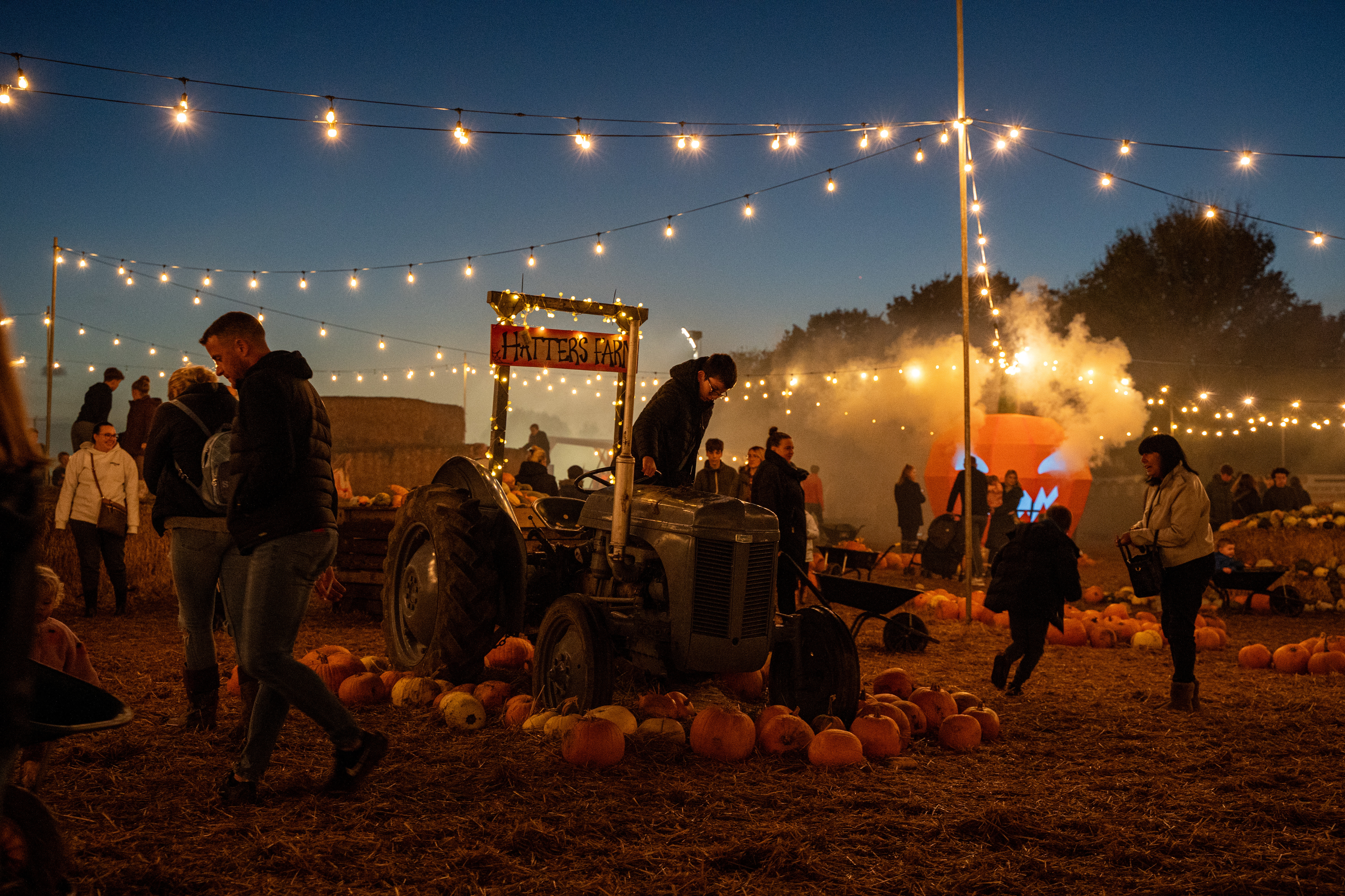 Night tractor with smokey pumpkin behind